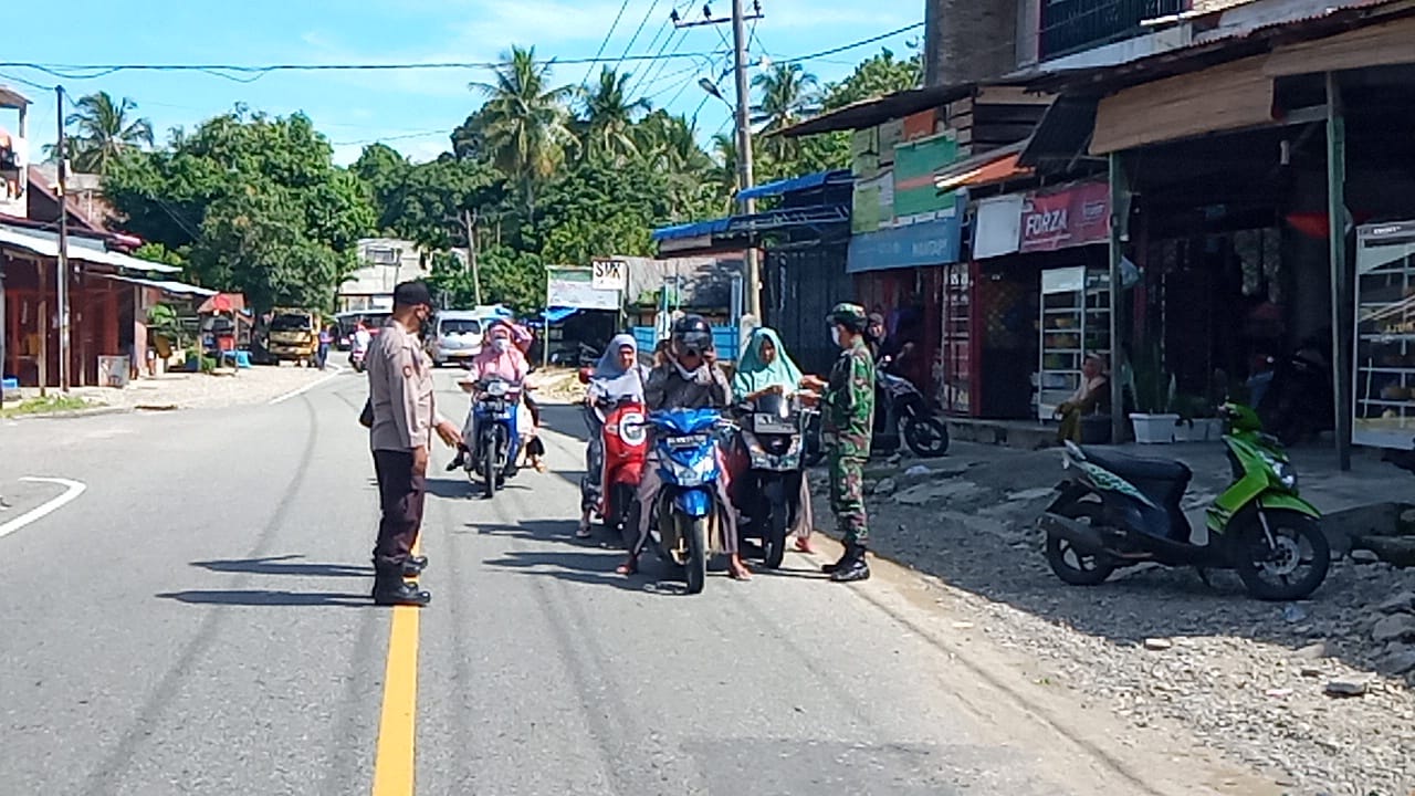 Turun Kejalan Posramil 09 Sosialisasi Protokol Kesehatan