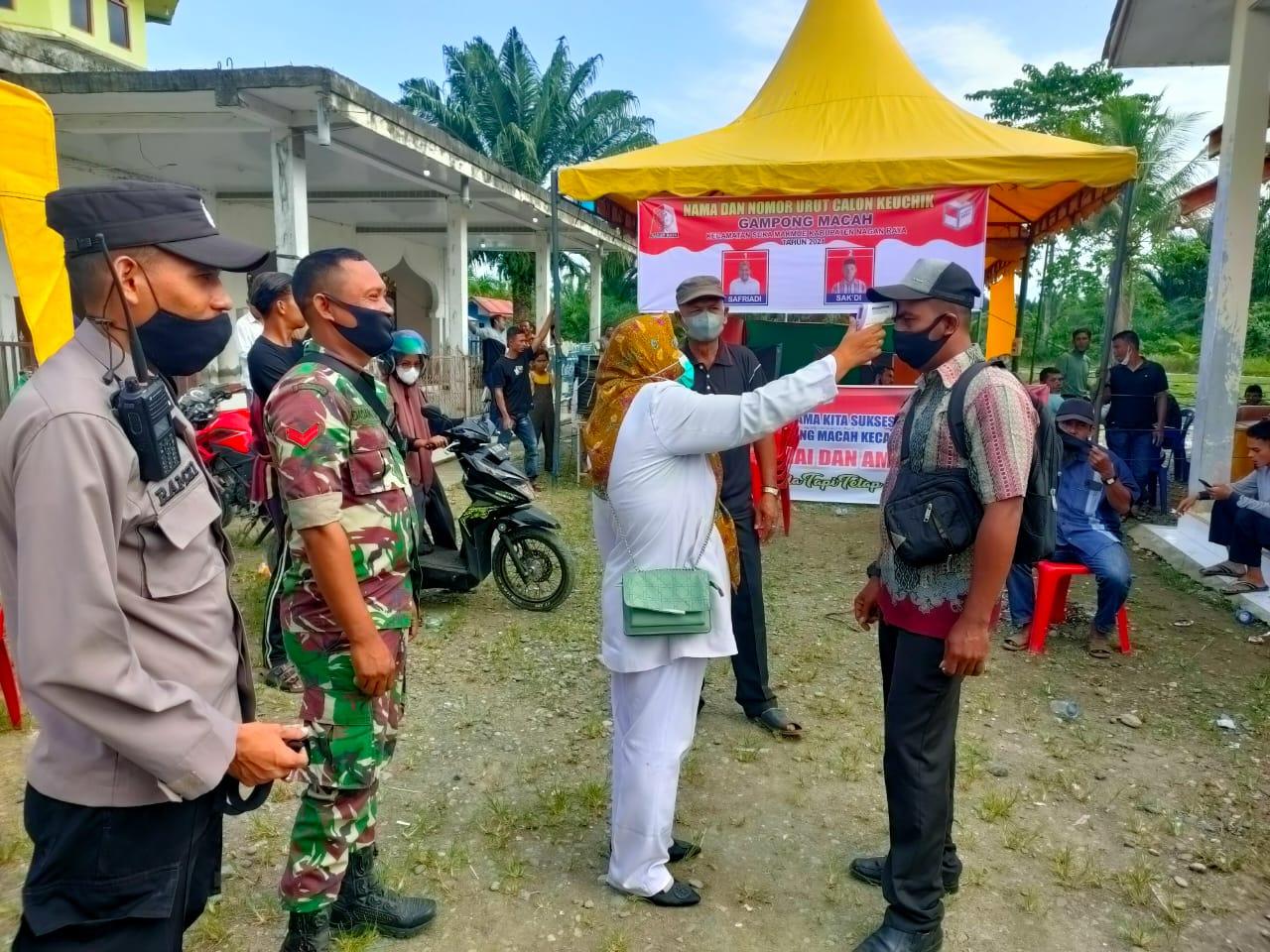 Sinergitas TNI-Polri Babinsa dan Babinkamtibmas Laksanakan PAM Pilkades Seretak Kabupaten Nagan Raya